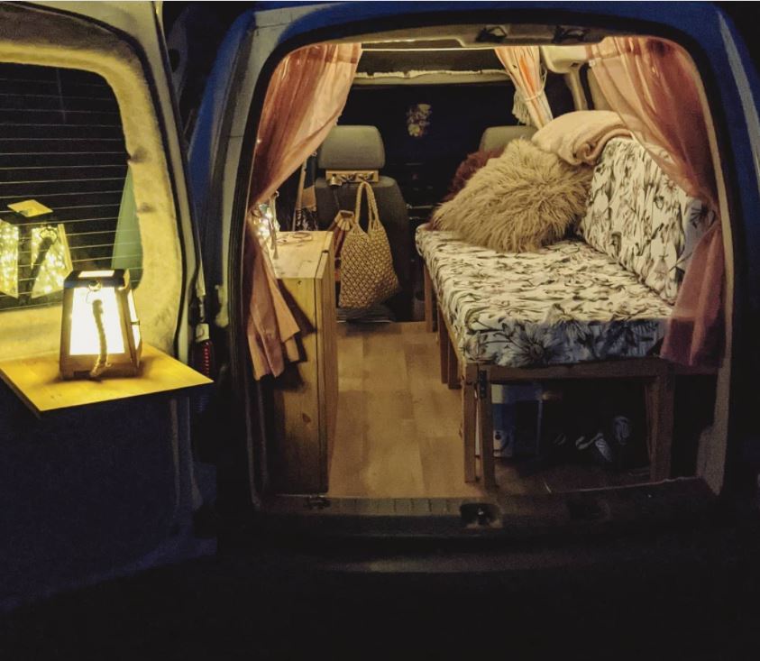 Rose Churchill's Volkswagen Caddy campervan interior at night